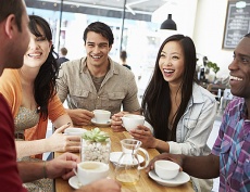 Group of young adults in a cafe setting.